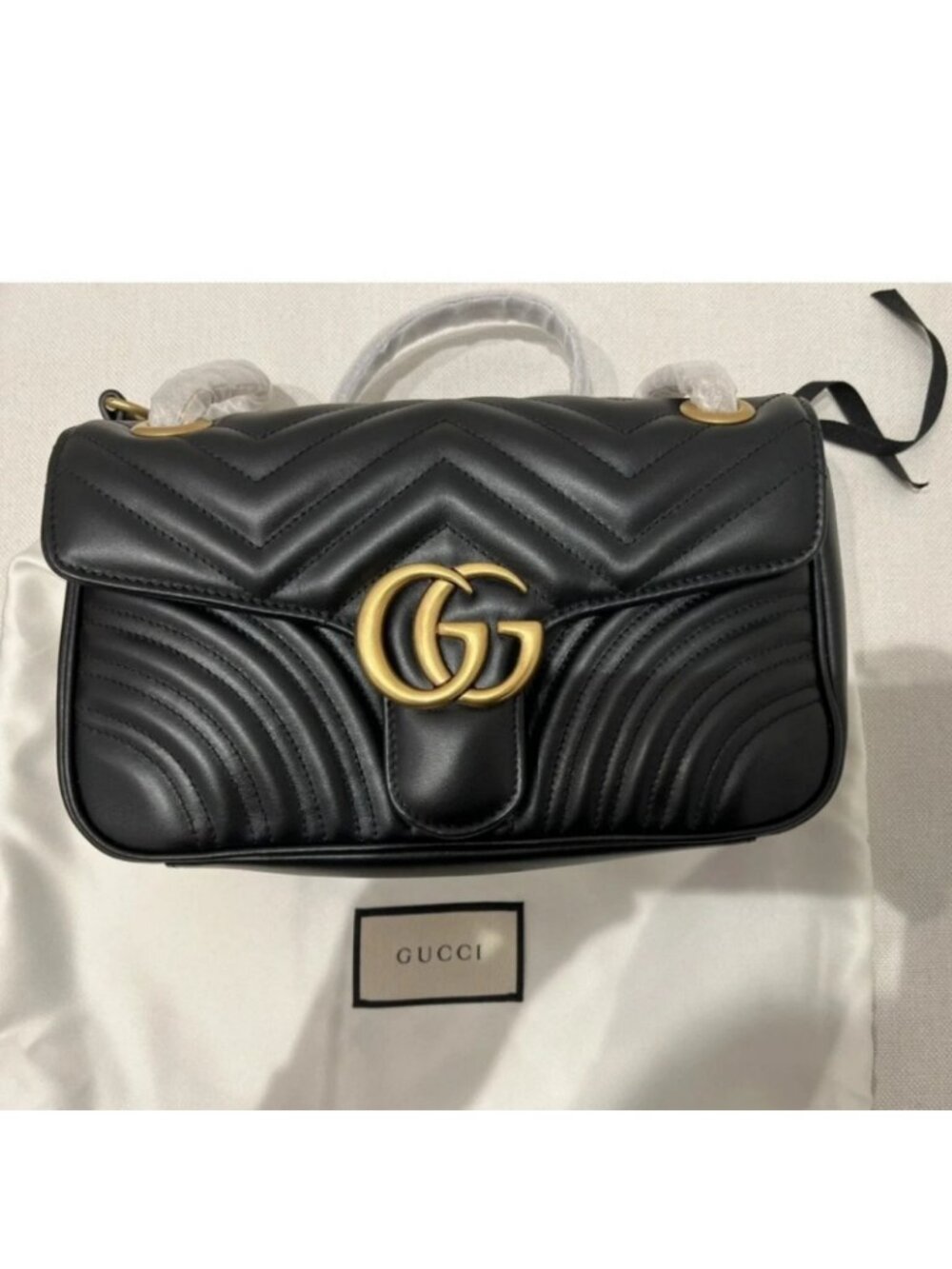 BlackGucci GG Marmont quilted black leather flap bag Gucci Marmont flap bag